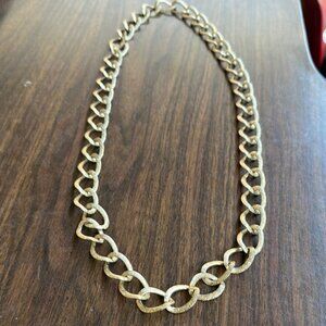 Elegant Gold Chain Necklace with design on every link.